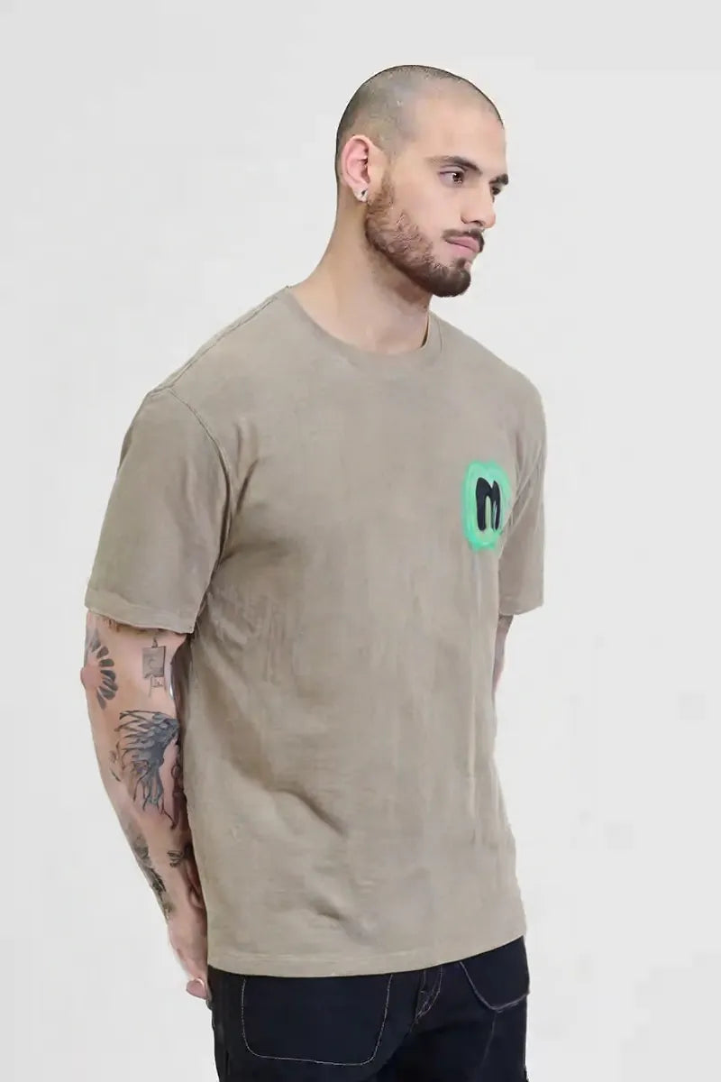 Men’s Beige Graphic T-Shirt with Neon Green “M” Logo – Urban Casual Streetwear